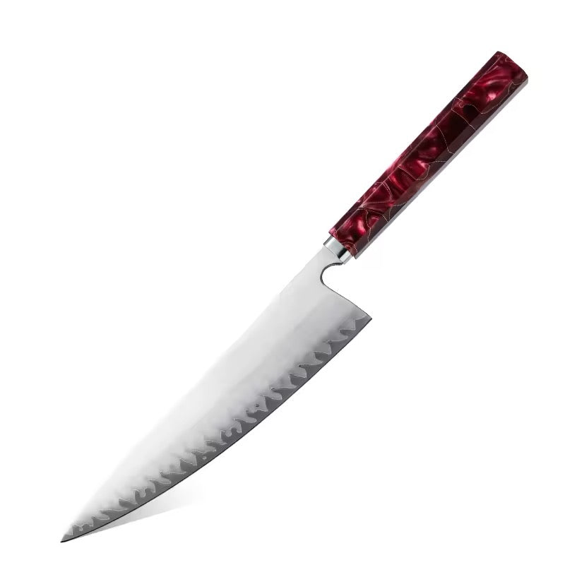 Chef's knife with a red handle on a white background